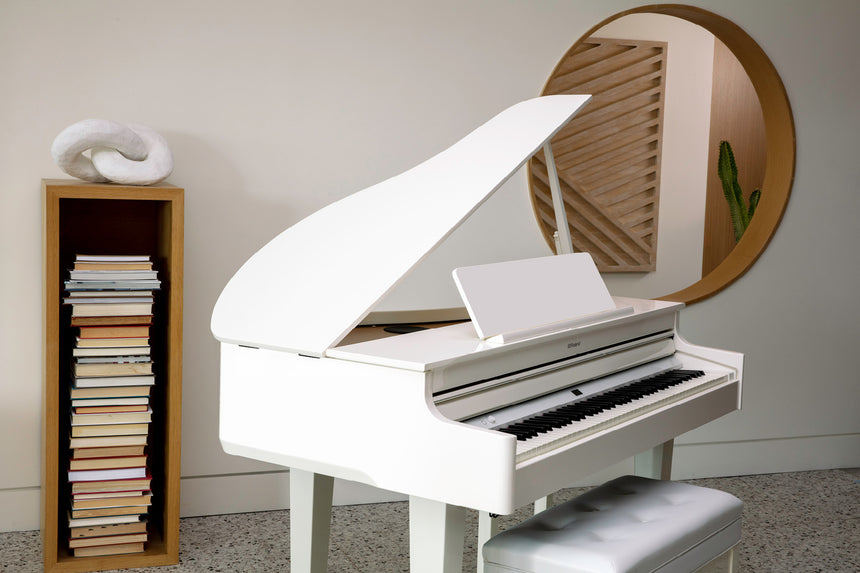Roland GP-6-PW digital grand piano in polished white – close view in a living room with the grand lid open.