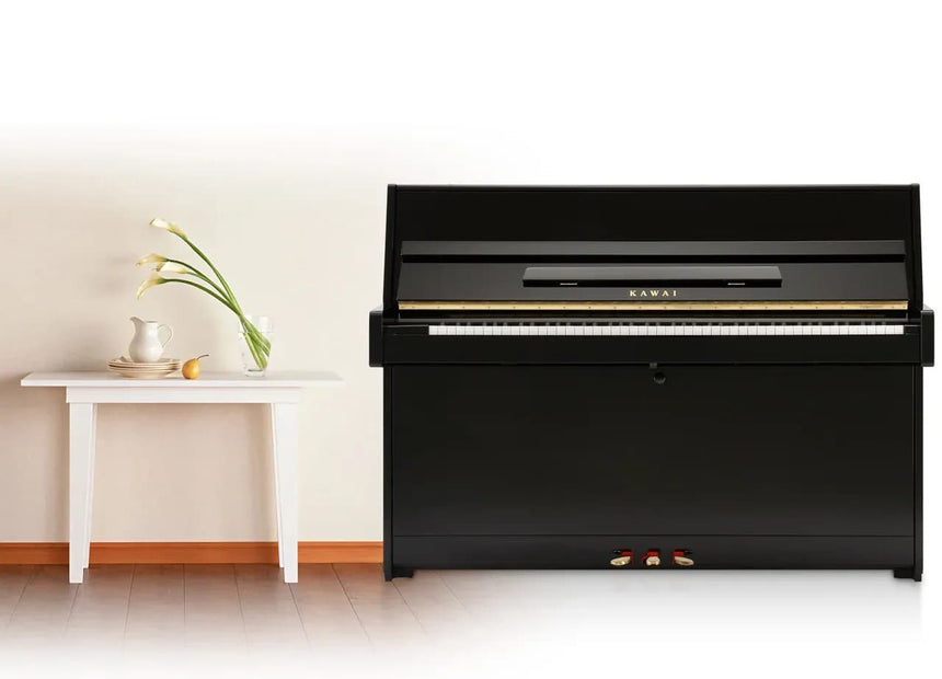 Kawai K-15 E upright piano in polished ebony – front view in a room.