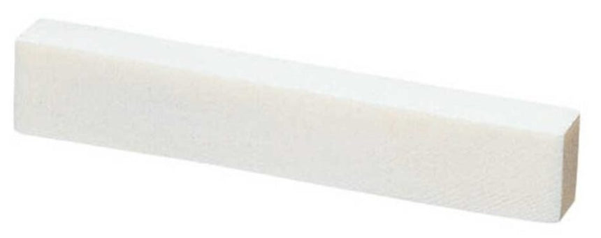 GEWA 547000 bone nut blank for classical guitar, angled view.