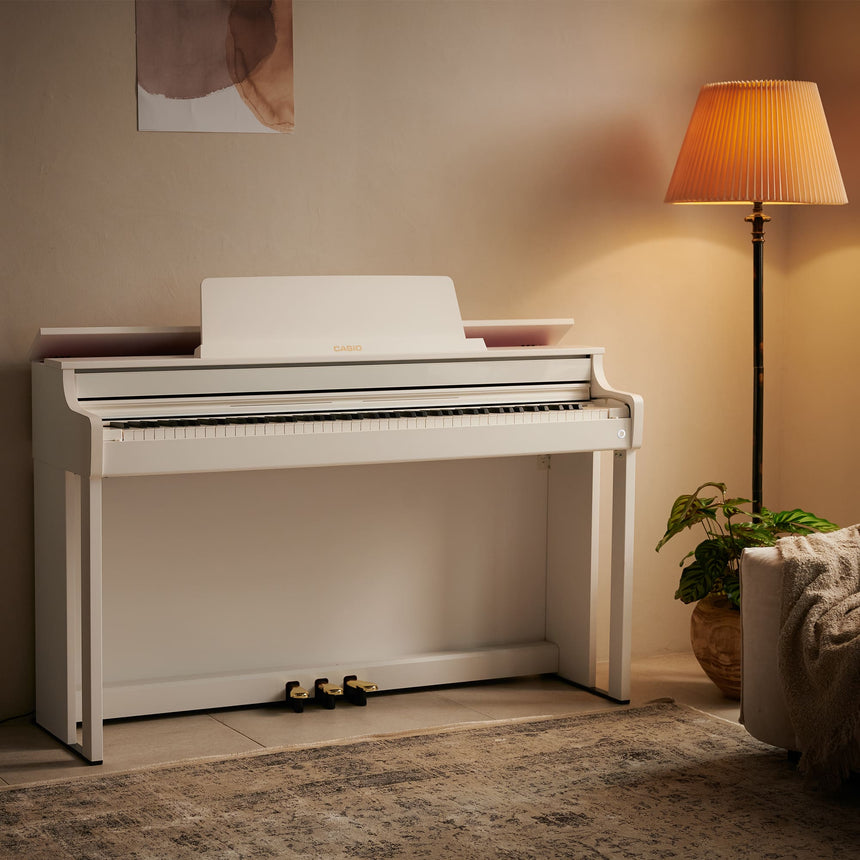 Casio AP-550WE digital piano in white – full view in a living room without a pianist.