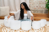 Meinl CSBSETCHA white frosted crystal singing bowl set – being played indoors