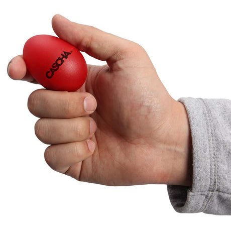 Red egg shaker from the Cascha HH-2003 set held in a hand